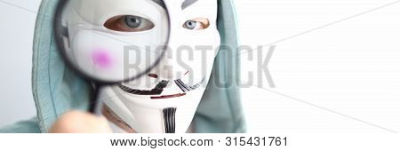 Minsk, Belarus, June, 2019: Hacker Wear Anonymus Mask With Magnifying Glass Illustrative Editorial