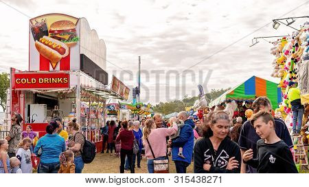 Sarina, Queensland, Australia - August 2019: Crowd On Sideshow Alley Enjoying Local Country Show