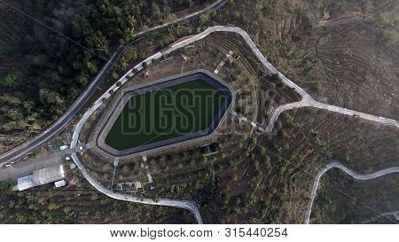 Agriculture Development Industry With Rainfed Reservoir On The Hill For Plantation