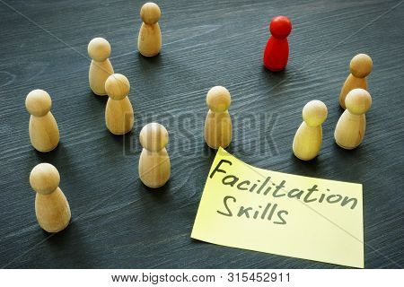Facilitation Skills Concept. Wooden Figurines As Symbol Of Teamwork.