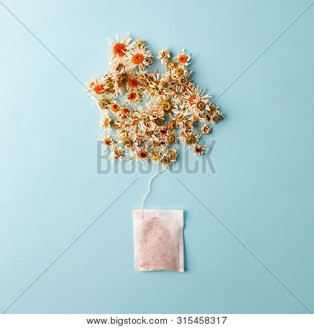Close Up Of Tea Time. Dry Camomile Tea In The Tea Bag, Minimal Concept. Chamomile Anti-depression Be