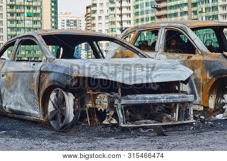 Burnt Car After A Fire, Body Parts Burnt Door Handles And Cracked Glass, The Picture Is Not Pleasant
