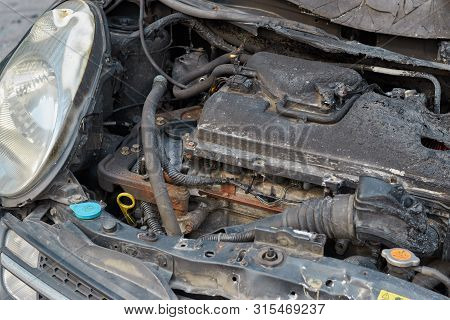 Burnt Car After A Fire, Body Parts Burnt Door Handles And Cracked Glass, The Picture Is Not Pleasant