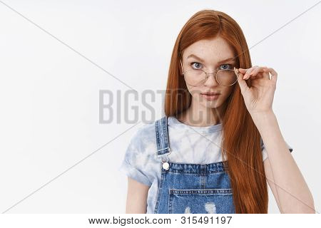 Serious-looking Suspicious Curious Redhead Cute Teenage Girl With Blue Eyes Freckles, Look From Unde