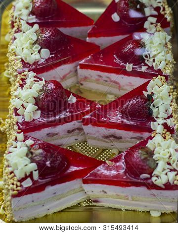 Strawberry Cake With Layers Of Souffle And Biscuit, Strawberry Jam With Berries And Chocolate Chips,