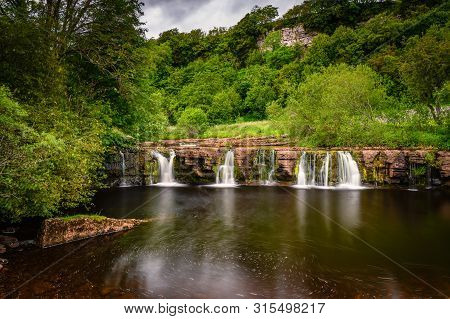 Long Exposure Of Wain Wath Force, A Waterfall Situated On The River Swale In The Yorkshire Dales Nat