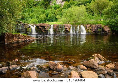 River Swale Flows Over Wain Wath Force, A Waterfall Situated On The River Swale In The Yorkshire Dal