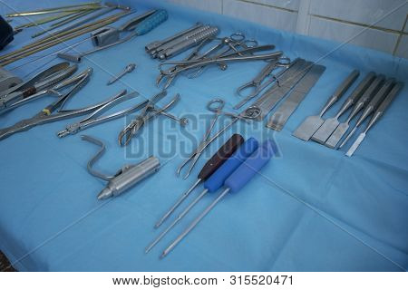 Surgical Toold Laid Out On A Table With A Blue Cloth Before The Surgery