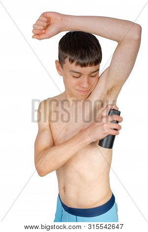 Teenage Boy Using An Under Arm Spray Isolated On A White Background