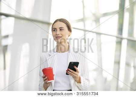 Business Woman With Phone On Street. Portrait Of Smiling Beautiful Young Female In Stylish Clothes C
