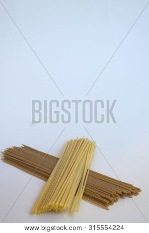 Raw Plain And Wholemeal Spaghetti Togheter On A Cloth