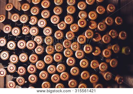 Bullets On A Wooden Background. Military Concept.