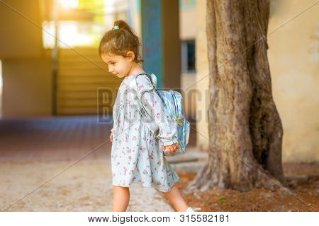 Pupil Kid Going To School In First Grade With Holographic Schoolbag Or Satchel, Child Walking To Sch