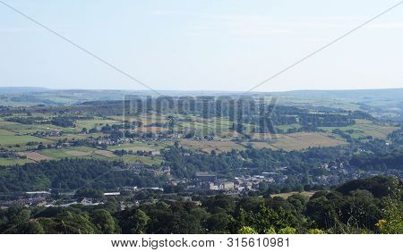 A Panoramic View Of The Countryside Around Sowerby Bridge In West Yorkshire With Buildings Of The To