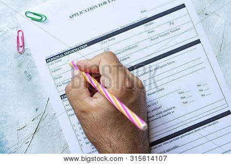 Hand Filling Standard Application For Employment. Hr, Hiring, Applicant Filling Job Application. Hr,