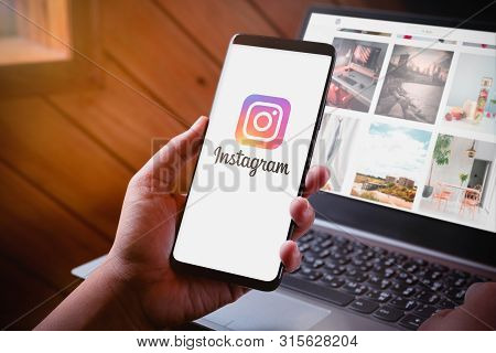 Bangkok, Thailand - August 6, 2019: Hands Holding Smartphone With Instragram Logo Screen And Instrag