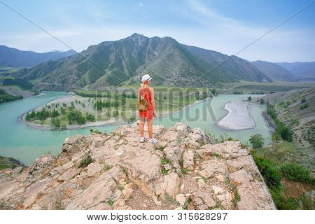 Woman Hiking In The Mountains. Woman Hiker Enjoy The View At Rive And Mountains. Adventure Outdoor A