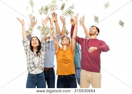 finance, wealth and people concept - group of happy friends picking money falling from up above over white background