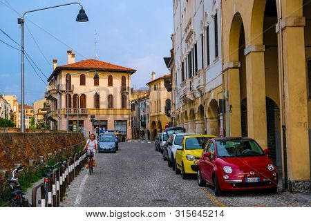 Rovigo, Italy - July, 7, 2019: cars parked on the street in Rovigo, Italy