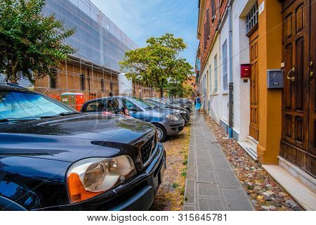 Rovigo, Italy - July, 7, 2019: cars parked on the street in Rovigo, Italy
