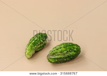 Trendy Two Ugly Organic Cucumders On Light Background, Horizontal Orientation