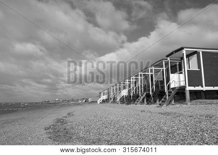 Black And White Image Of The Beach Huts At Thorpe Bay, Near Southend-on-sea, Essex, England