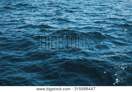 Abstract Blue Water Sea For Backgroundblue Sea Background. Calm Water In The Sea Or Ocean. Happy Sum