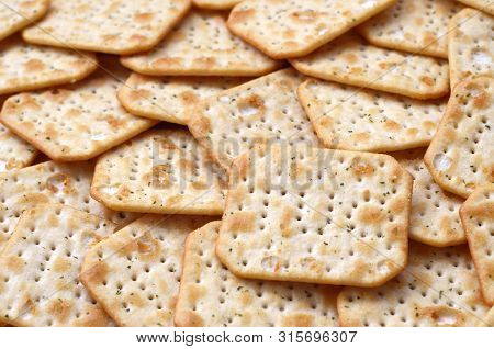 Tuc Original Snack Crackers Lies On Market Table Stacked In Big Pile