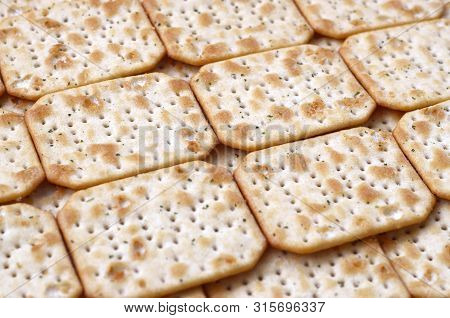 Tuc Original Snack Crackers Lies On Market Table Stacked In Big Pile