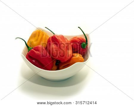 Habanero Pepper In A White Bowl On White Background.