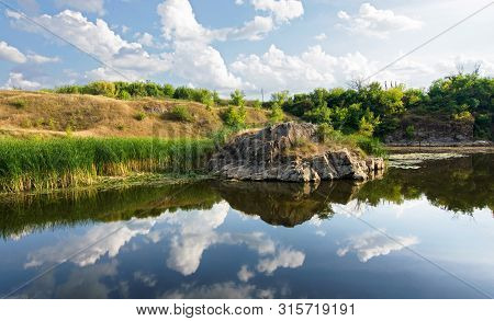 Stone Cliff On The River Bank On Sunny Day. Tyasminsky Canyon  In Kamianka Cherkasy Region. Ukraine