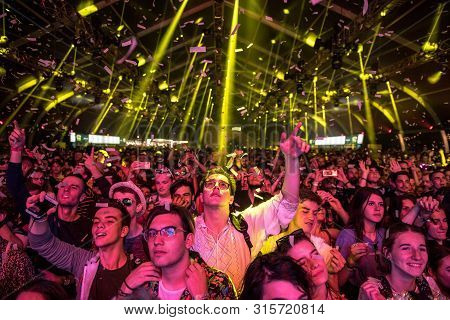 Cheerful Partying Crowd Of People At Music Festival