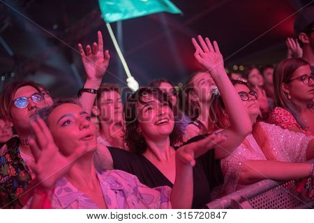Cheerful Partying Crowd Of People At Music Festival