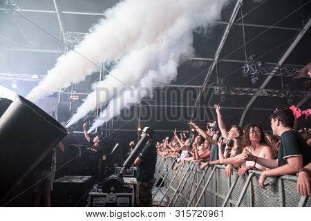 Cheerful Partying Crowd Of People At Music Festival