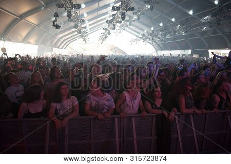 Crowd Of People Headbanging And Partying