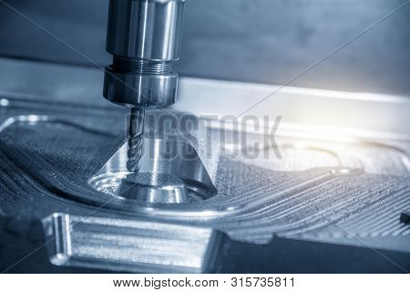 The Cnc Milling Machine Cutting The Forging Mould Part With Solid Radius Endmill Tool. The Mould And