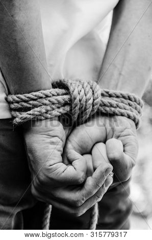 Man With Hands Tied.  Restraint Concept. Monochrome