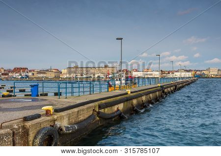 Hel, Poland- 31 January 2015: View Of The Breakwater And Seaport In The City Of Hel. Town And Baltic