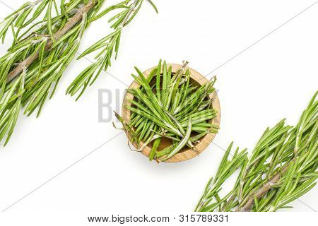 Group Of Two Whole Lot Of Pieces Of Fresh Evergreen Sprig Of Rosemary In A Wooden Bowl Flatlay Isola