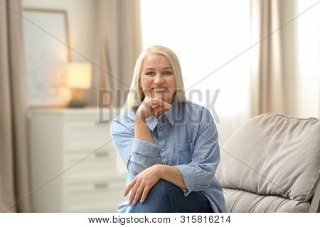 Portrait Of Happy Mature Woman At Home
