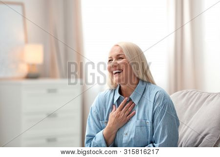 Portrait Of Happy Mature Woman At Home