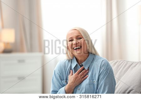 Portrait Of Happy Mature Woman At Home