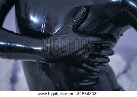 Man In The Latex Rubber Black Catsuit With Gasmask