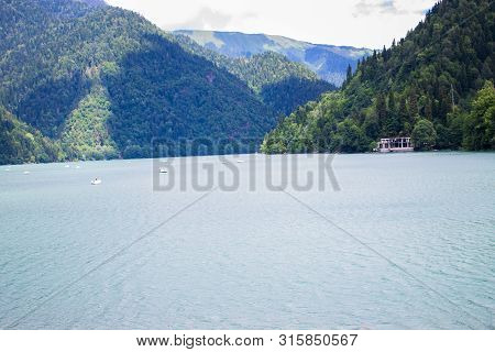 Beautiful Mountain Lake Ritsa. Ritsa Lake In The Mountains Of The Caucasus, In The Northwestern Part