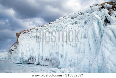 Sharga-dogan Island Covered With Beautiful Icicles On Lake Baikal In Winter. Siberia, Russia.