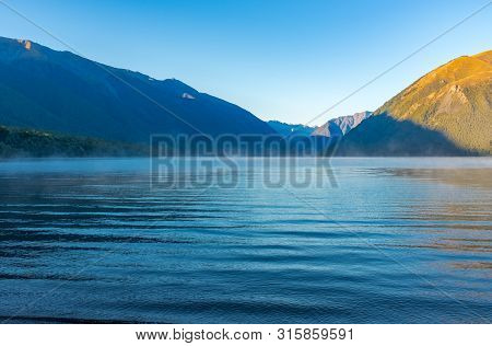 A View Down The Incredibly Beautiful Rotoiti Lake Surrounded By Mountains Which Is Part Of The Nelso