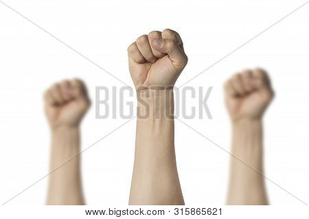 Male Hands Clenched Into A Fist And Raised Up On A White Background. Concept Of Power, Rebellion, Un