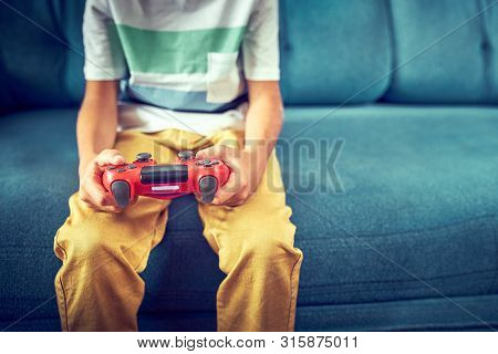 Video Gamer Plays With A Joystick In The Game