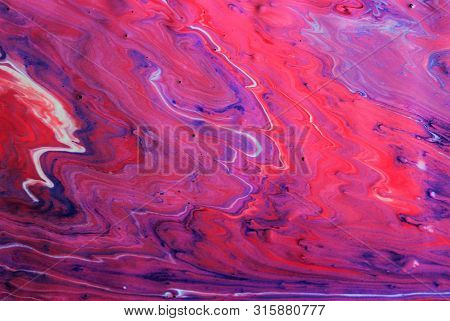 Red-white-blue-purple Abstract Marble Background. Bright Color. The Paint Flows Freely And Creates A