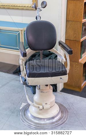 Antique Black Dentist Leather Chair With Headrest.